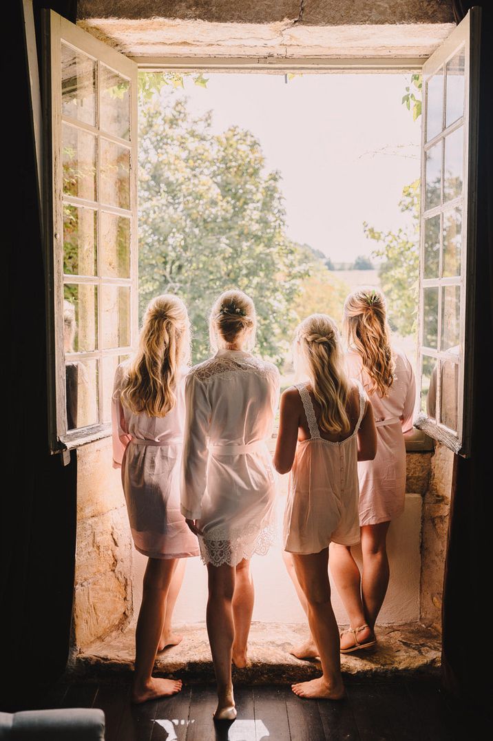 Ladies with blonde hair looking out the window celebrating together for Galentine's Day