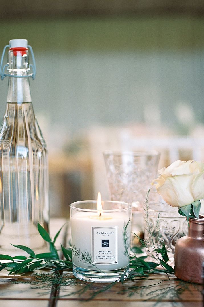 Jo Malone London wedding candle lit on the table in wood sage & sea salt scent 