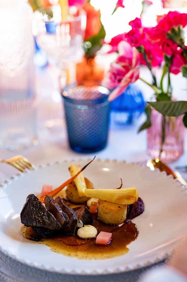 Hay smoked venison haunch, beetroot, fondant potato, roasted root veg, pomegranate jus wedding breakfast ideas by Taste Caterer 