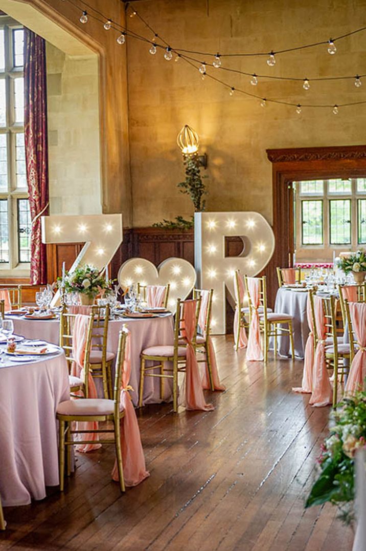 Personalised letter lights with festoon lighting with pink table decorations 