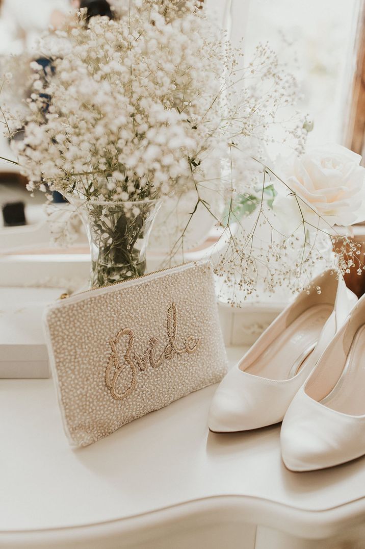 Embellished clutch with gold stitched Bride to the front 