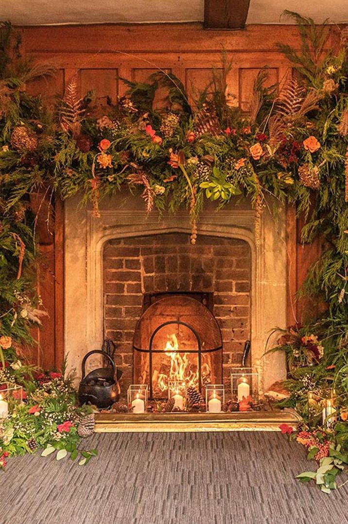 Cosy fireplace centrepiece at Surrey wedding venue 