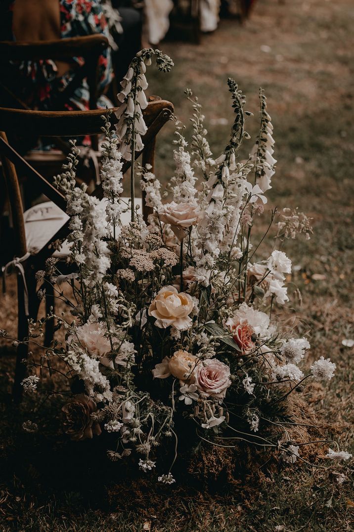 White wedding flowers on the aisle decorations 