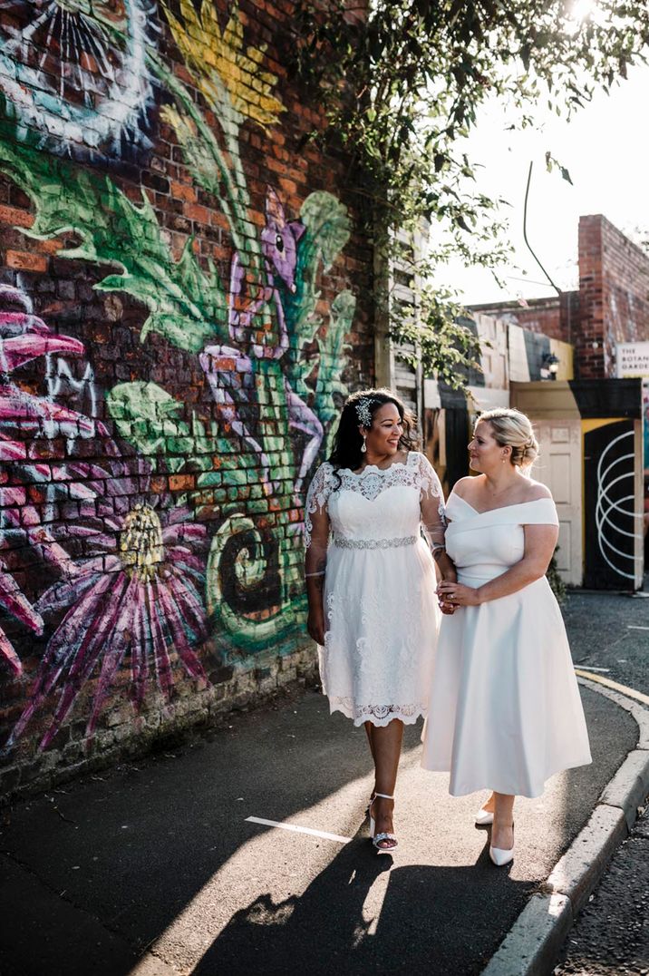 Brides walk holding hands together for their Liverpool wedding under 5k 