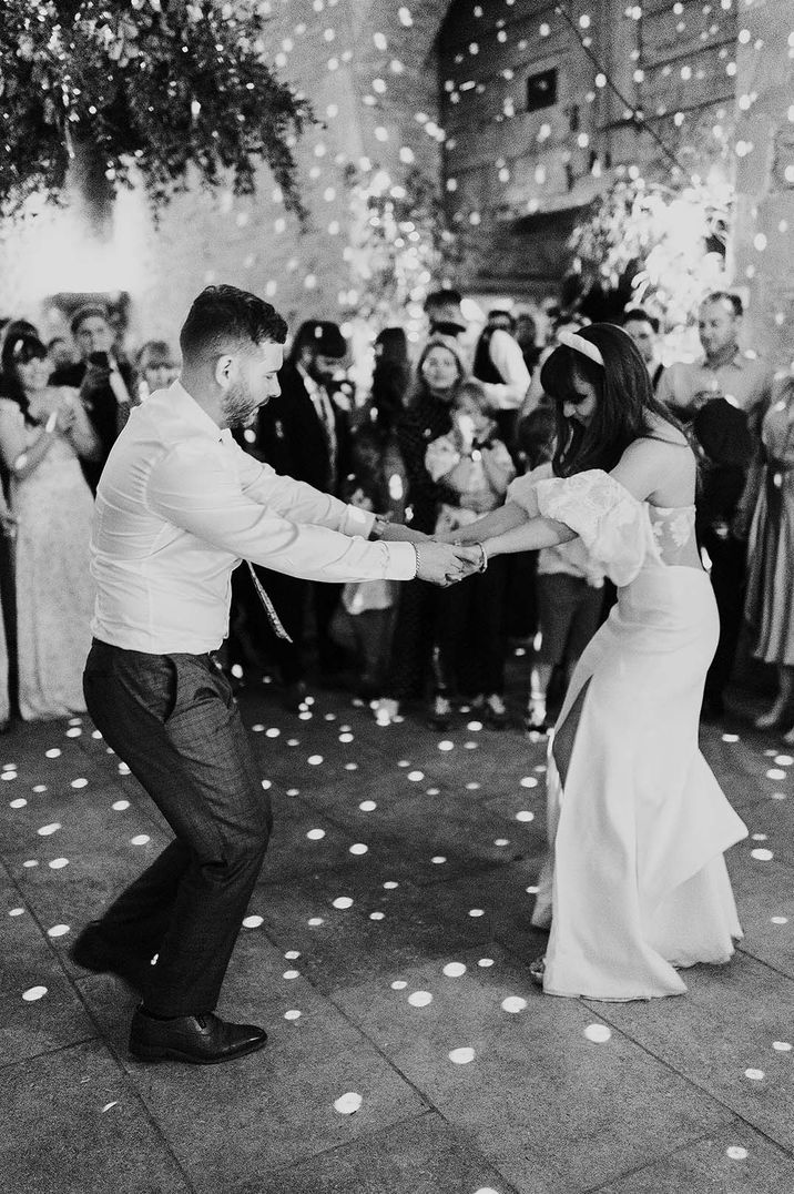 Bride & groom dance on their wedding day during reception party