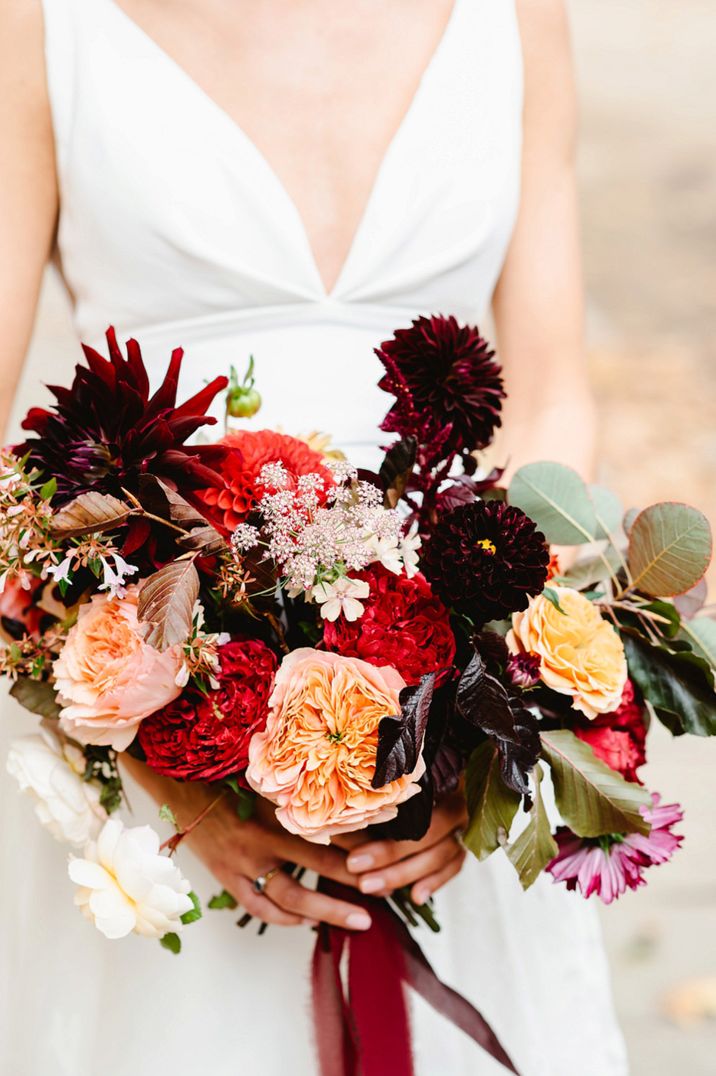 Deep red, vibrant red and orange autumn wedding bouquet