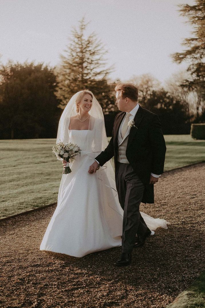 Bride in square neck wedding dress at Hedsor House