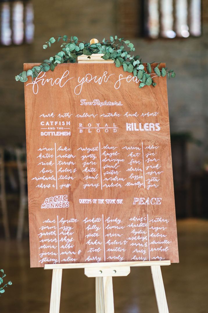 Wooden effect table plan for rustic wedding 