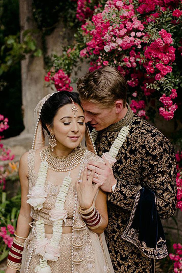 Varmala wedding garlands for Hindu wedding ceremony with the bride and groom posing together for cute couple portrait