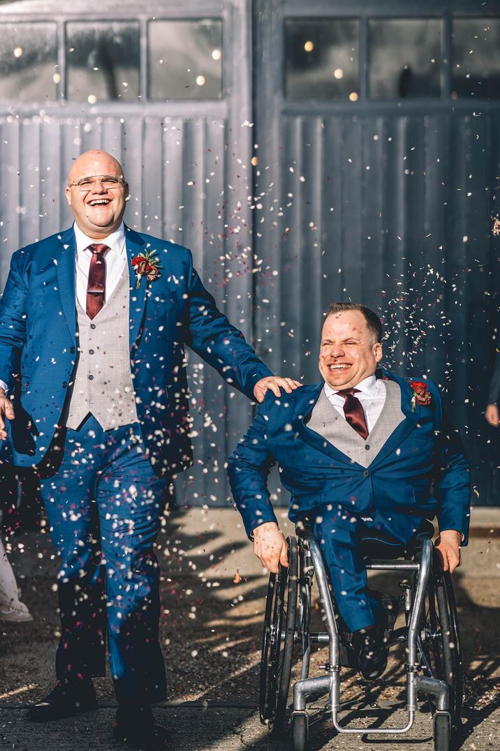 Confetti moment for grooms in custom-made blue wedding suits from Vietnam 