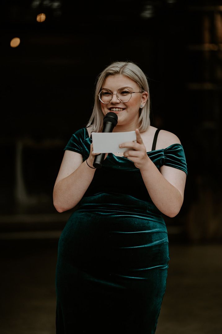 Maid of honour speech in dark green velvet off the shoulder dress