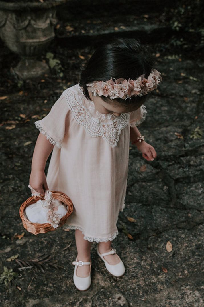 Flower girl in pale pink linen dress