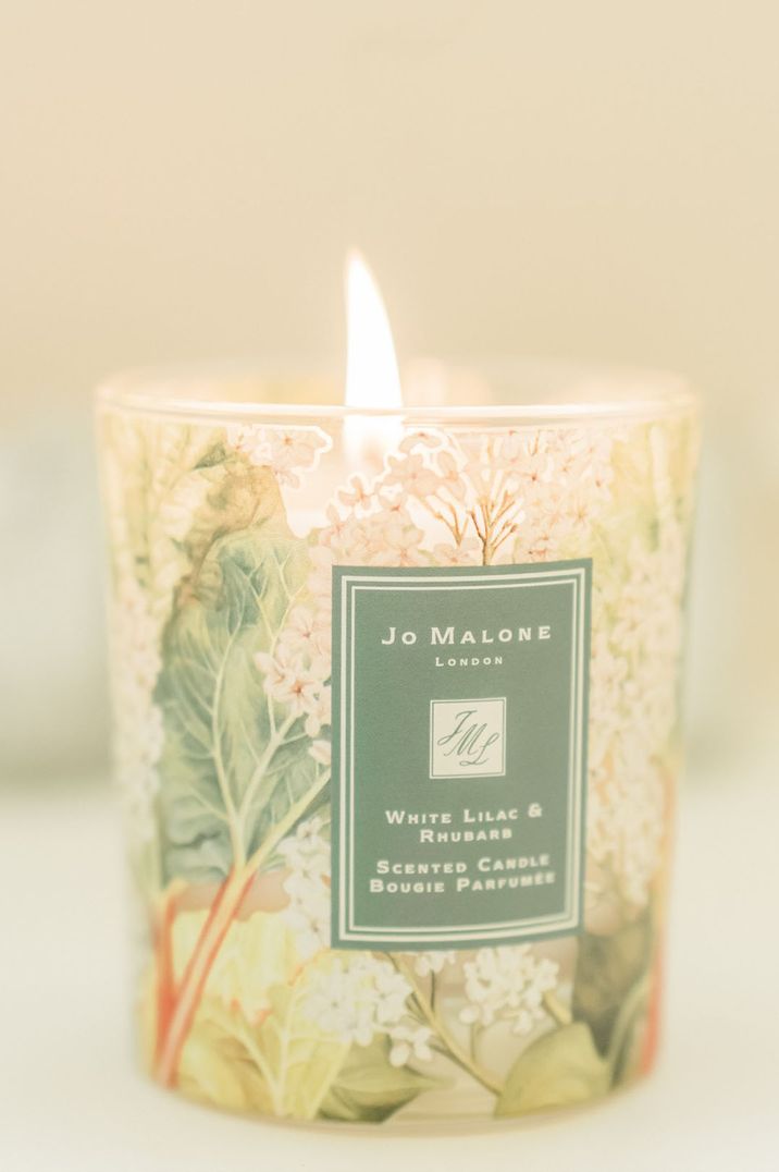 Unique floral Jo Malone London candle lit to scent the wedding venue 