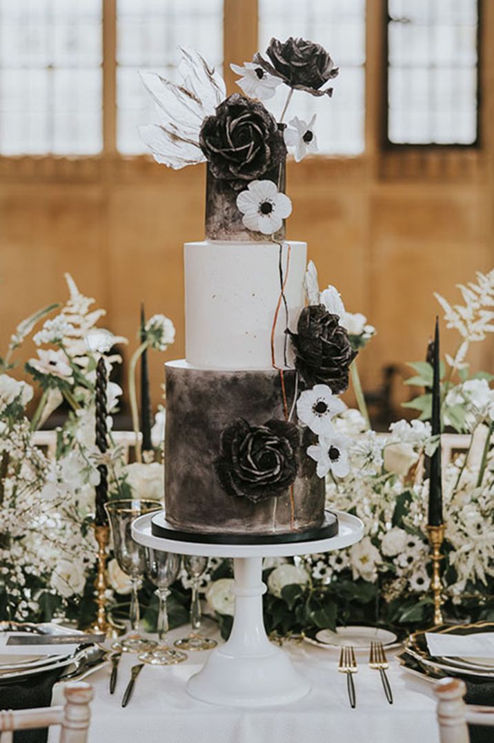 Monochrome black and white wedding cake with white anemones and black rose cake decorations 