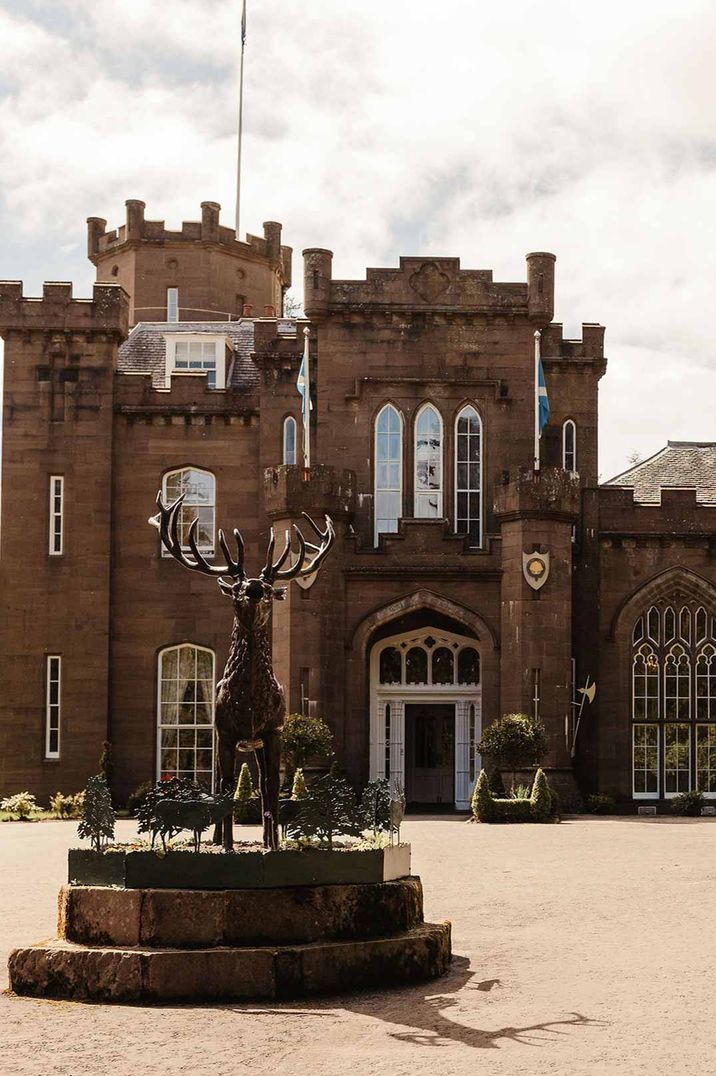 Exterior of large stag statue outside of Drumtocthy Castle wedding venue Scotland