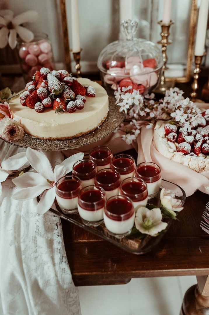 Wedding dessert table with pavlova, cheesecake and mini trifles 