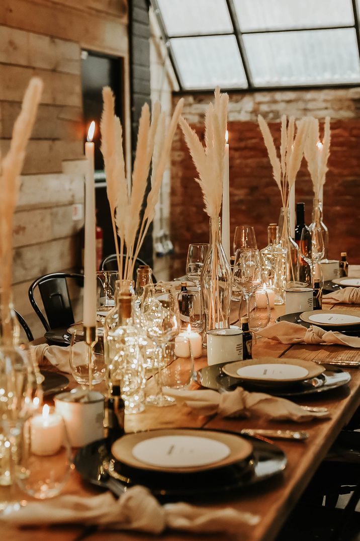 Neutral toned wedding tablescape with pampas grass floral displays at The Shack Revolution