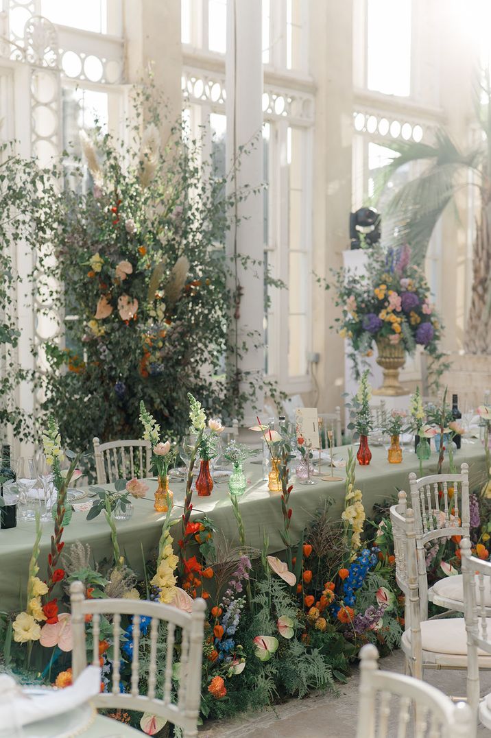 Meadow theme botanical wedding with colourful flowers and plenty of foliage at glasshouse wedding venue 