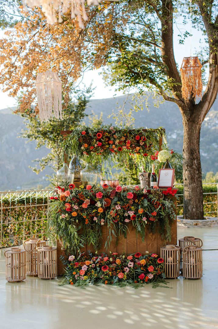 Destination wedding in Greece with red colourful flower decorations 