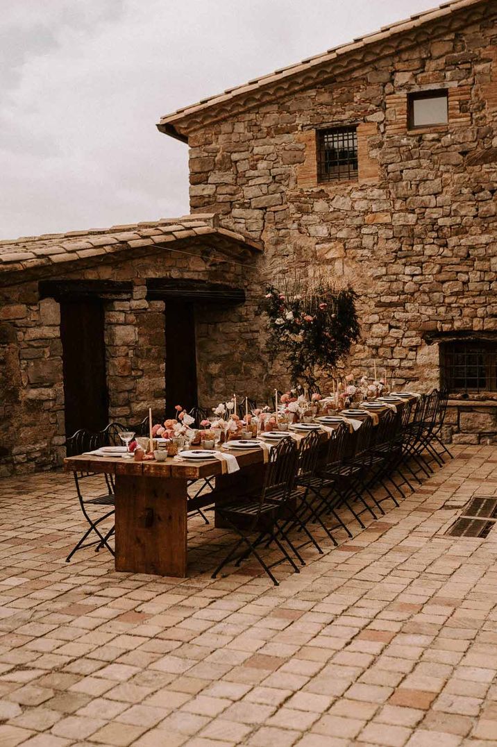 Rustic outdoor al fresco wedding breakfast - classic rustic wedding tablescape at Barcelona wedding venue This Must Be The Place 