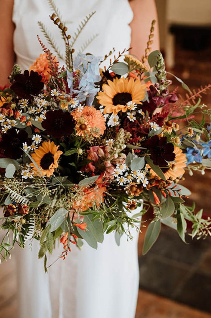 Autumnal seasonal wedding bouquet with sunflowers, daisies and more 