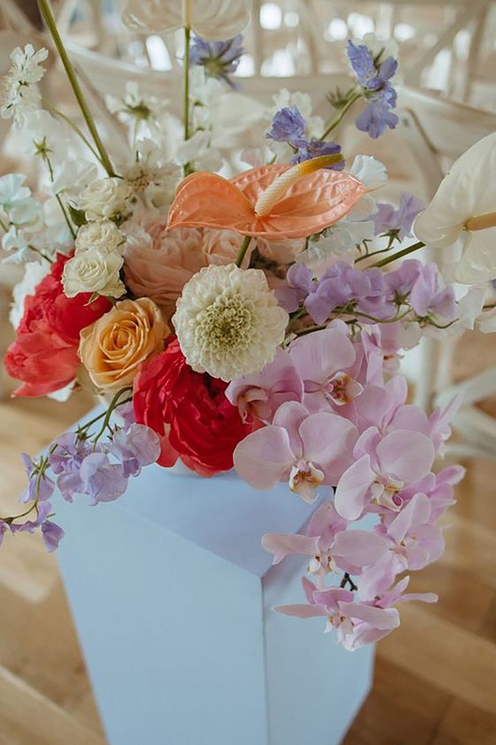 Pastel wedding flowers in shades of lilac, white, orange, red and pink by Alba Turnbull Photography