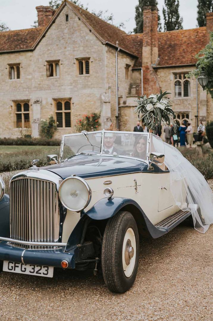 Vintage blue and cream wedding car for wedding transport