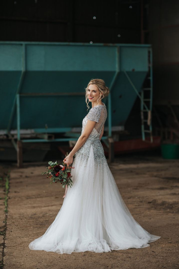 Bride wearing silver sequin wedding dress by Jenny Packham with a drop waist silhouette 