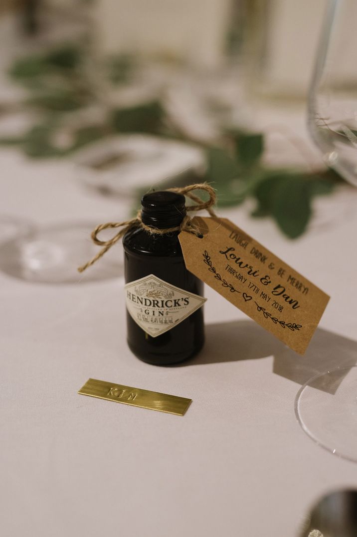 Personalised brown wedding favour tag attached to mini bottle of Hendrick's gin 