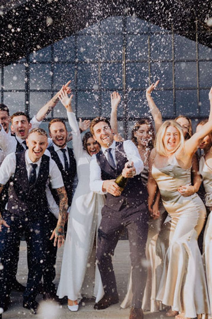 The Barn at Botley Hill wedding venue in Surrey with the bridesmaids in gold dresses and groomsmen in navy suits 