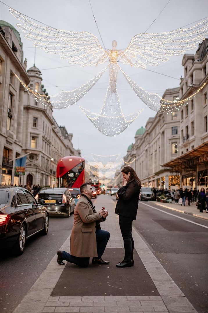 A romantic Christmas proposal in London with fairy lights 