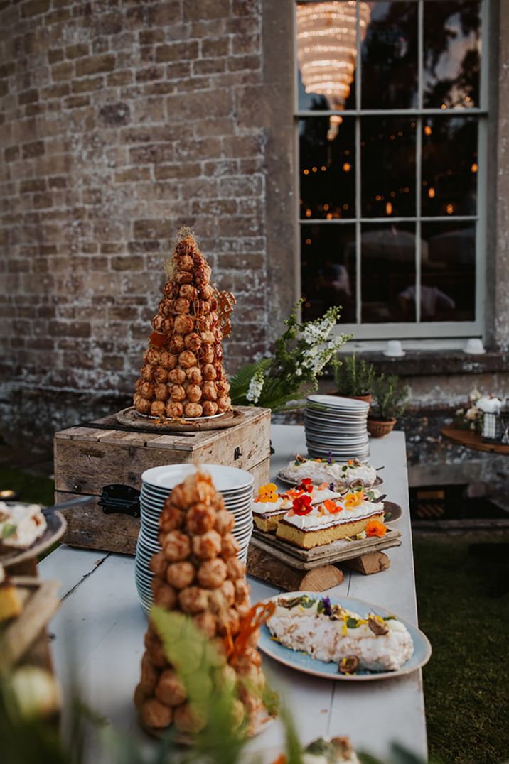 Wedding dessert table engagement party idea with croquembouche and other sweet treats 