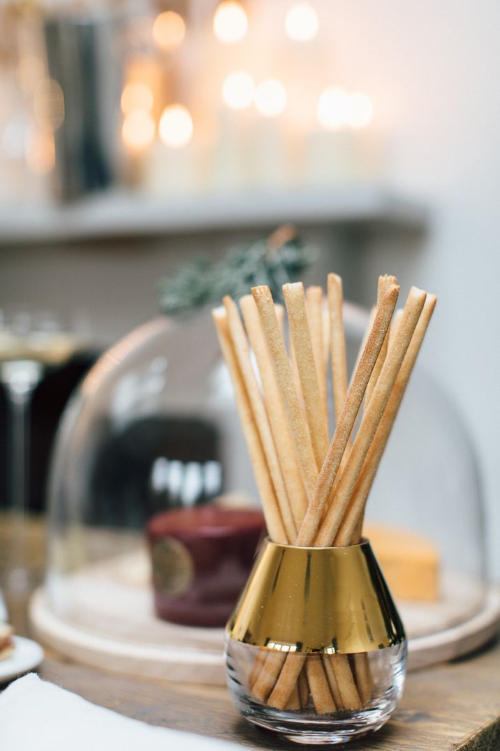 Breadsticks in silver small container at Christmas soiree 