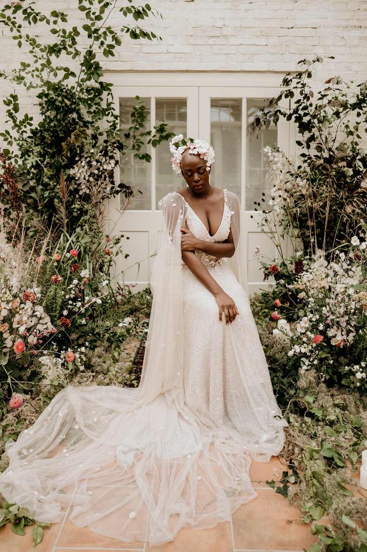 Bride with alopecia wearing rose bridal crown and sparkly strappy wedding dress with sheer bridal wedding wings at Our Beautiful Glasshouse venue 