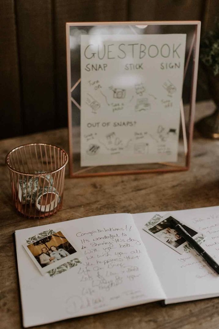 Wedding guest book with polaroid photos and golden framed wedding guestbook sign 