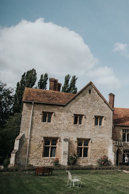 Exterior of Notley Abbey wedding venue in the daytime - ways to save for your wedding 