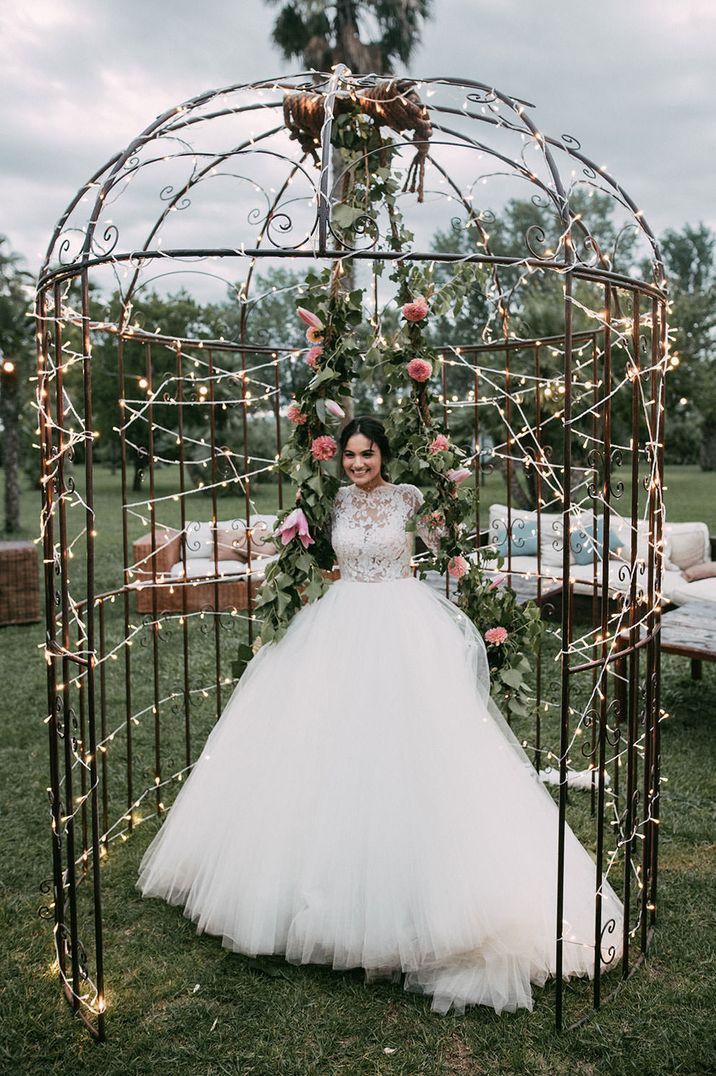 Huge tulle skirt princess wedding dress with long sleeves and lace detail by Sara Lobla Photography