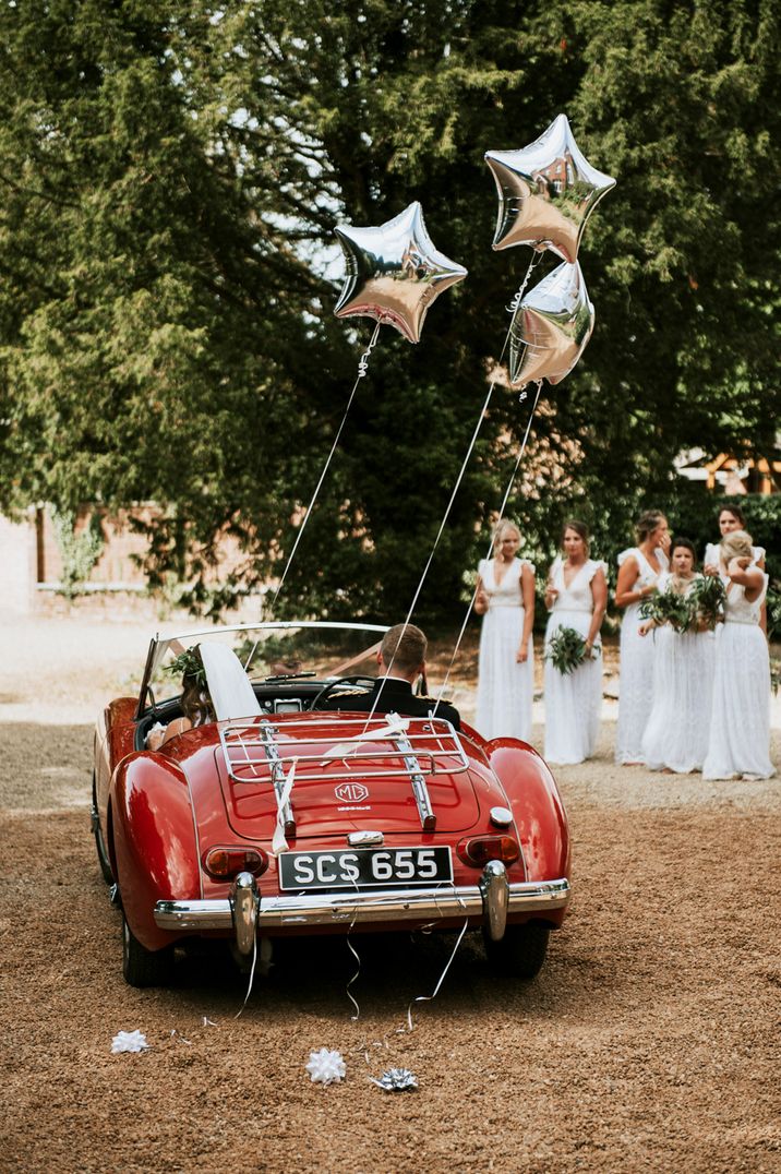 Red convertible wedding car 