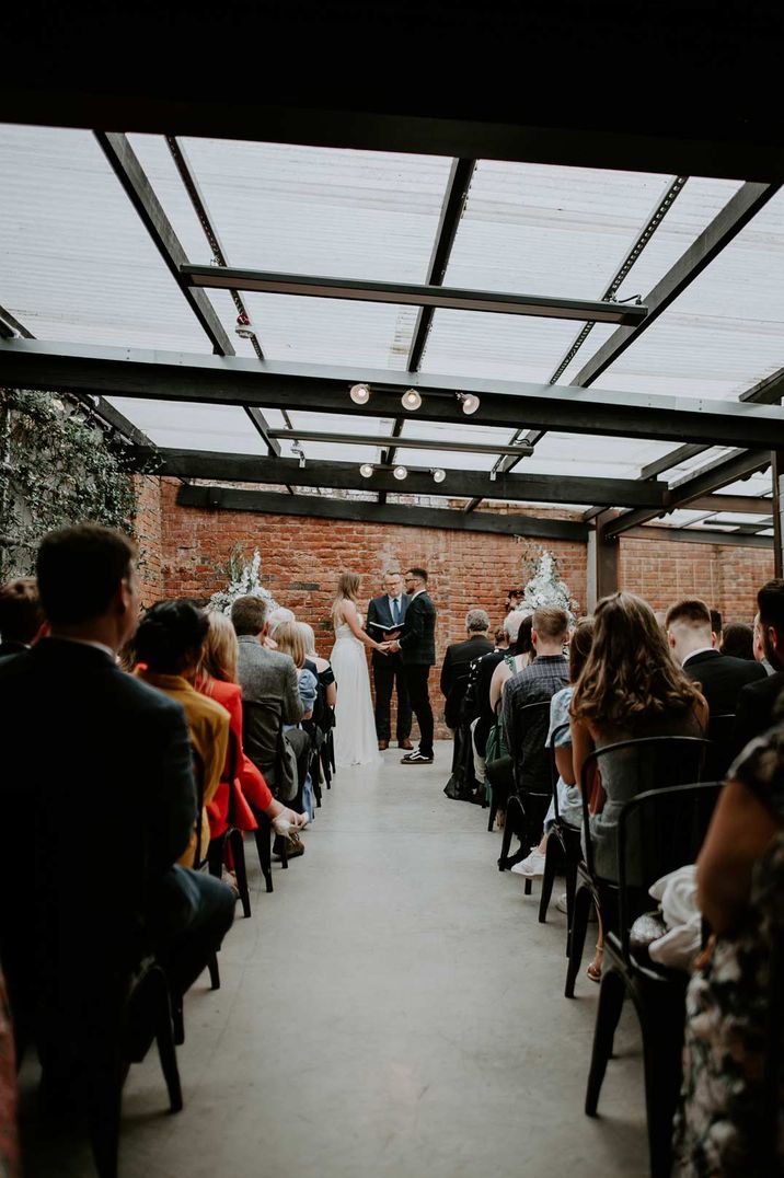 Bride and groom getting married at the alter of one of the best unusual wedding venues, Shack Revolution