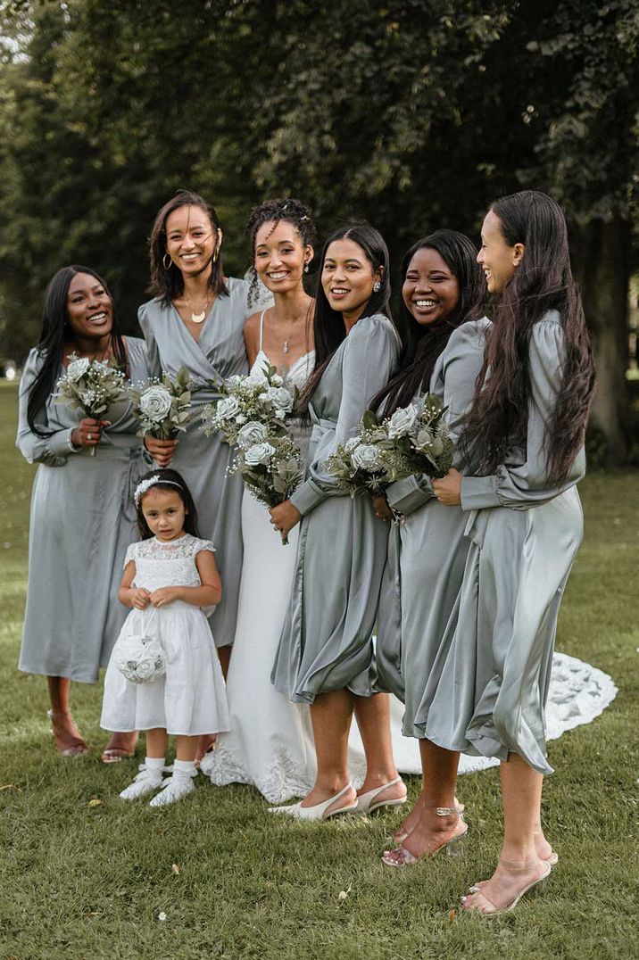 Bridal party wearing wrap front long sleeve midi grey bridesmaid dresses 