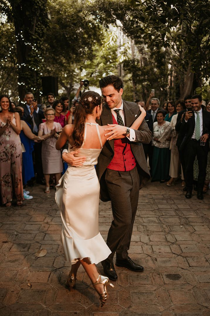 Bride and groom dance outdoors at their destination wedding 