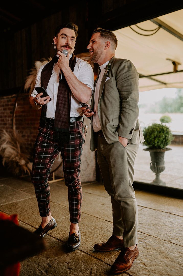 Two men perform stand up routine and funny wedding speech at wedding 