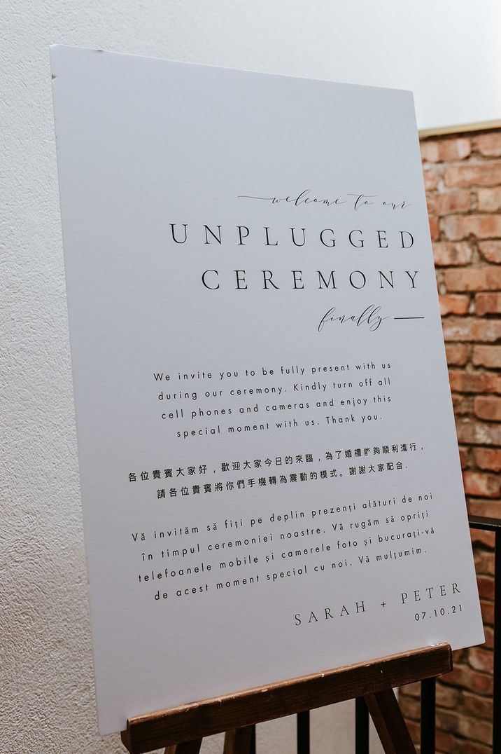 Plain black and white minimal unplugged wedding ceremony sign