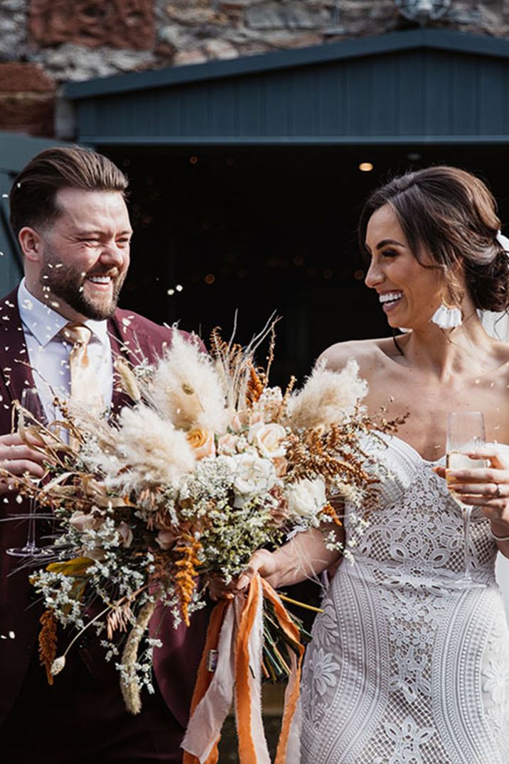 Confetti moment for bride and groom at Low Hall The Lakes wedding venue in the Lake District 