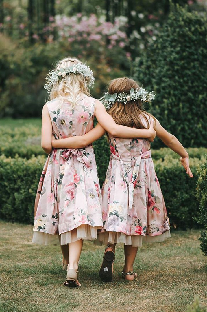 Girls in pink floral dresses and gypsophila flower crowns 