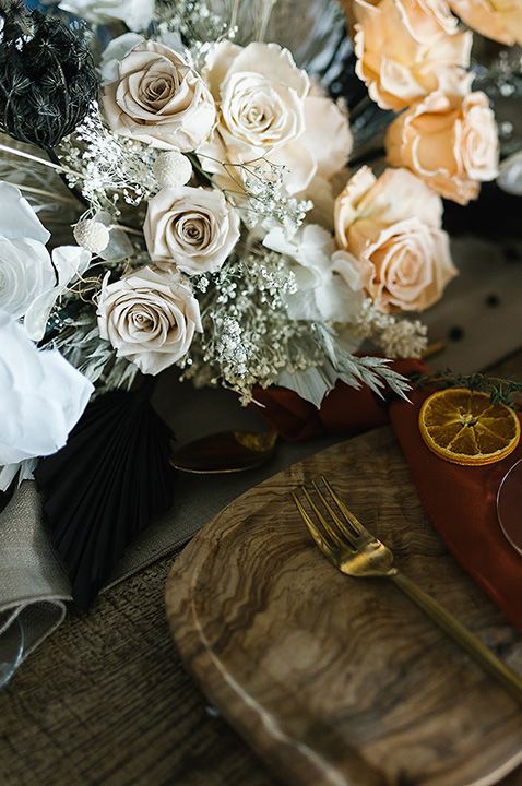 Wedding table and centrepiece preserved flower decoration made up of roses, gypsophila, and dried grass