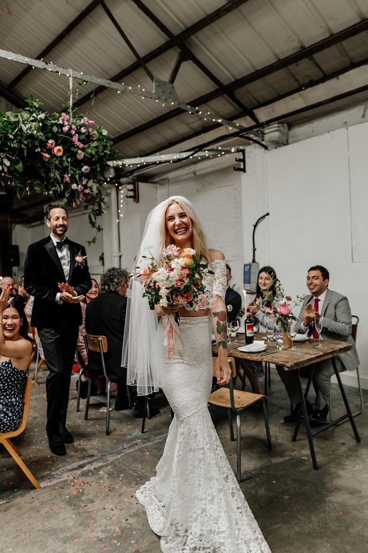 Bride in lace bridal separates at stylish Hackney Studios wedding 