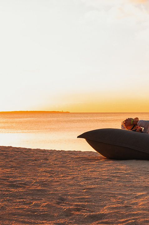 Image of honeymoon destination at Zuri Zanziba with couples watching sunset on the beach