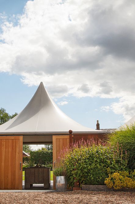 Accessible wedding venue with tipi roof marquee area.