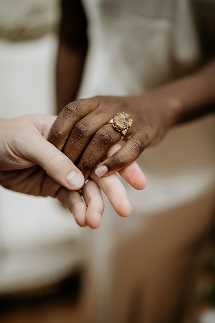 Bride and groom in new golden wedding rings